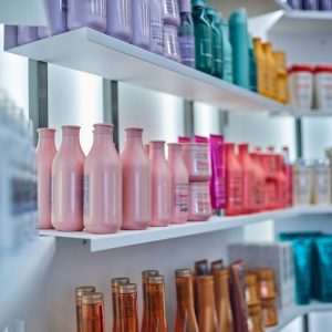 Beauty salon interior Modern beauty salon interior. Different cosmetics on shelves.