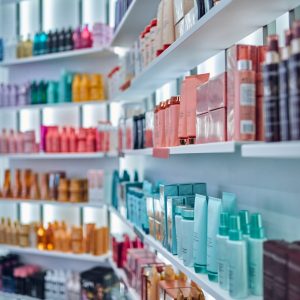 Beauty salon interior Modern beauty salon interior. Different cosmetics on shelves.