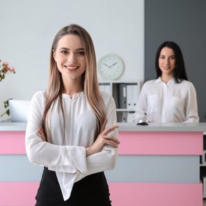 Young female receptionist in hotel Young female receptionist in hotel