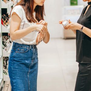 Young pretty woman chosing color cosmetic and beauty consultant Young pretty woman chosing color cosmetic and beauty consultant