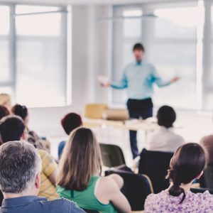 Speaker Giving a Talk at Business Meeting. Speakers Giving a Talk at Business Meeting. Audience in the conference hall. Business and Entrepreneurship concept.